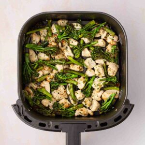 An air fryer tray bake with garlic butter chicken and broccoli.